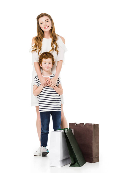 mother and son with shopping bags - Fotoğraf, Görsel