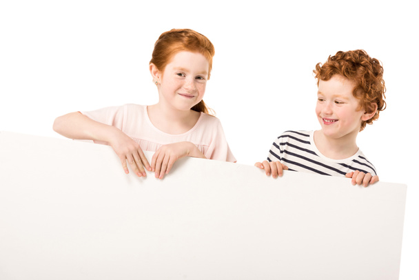 redhead siblings with shopping trolley - Fotó, kép