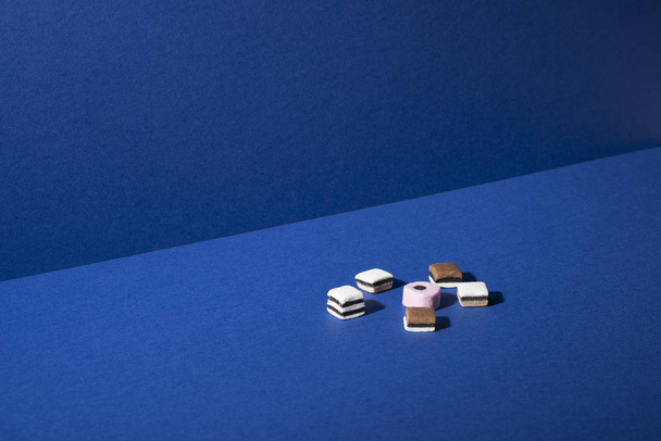 Assorted Shortbread Squares on Blue Background with Copy Space - Valokuva, kuva