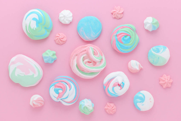 meringues in pastel colors, pattern abstract on pink background - Photo, Image