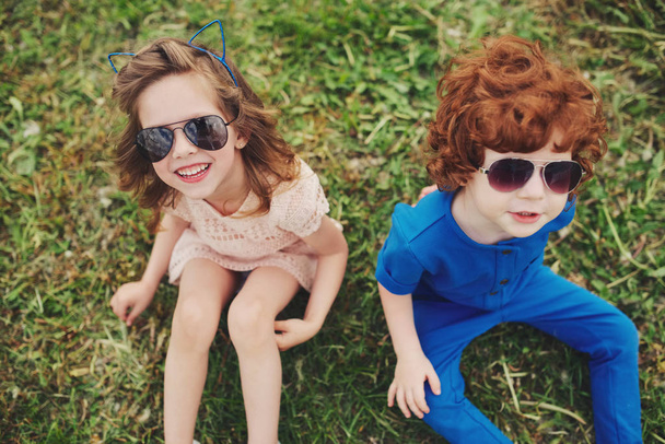 cute stylish children in summer park - Foto, afbeelding
