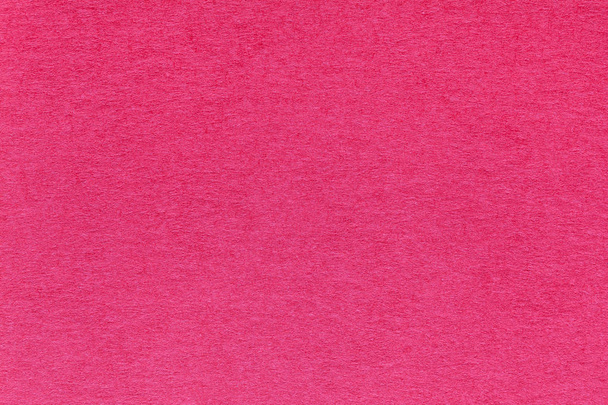 Texture of old bright red paper background, closeup. Structure of dense magenta cardboard - Photo, Image