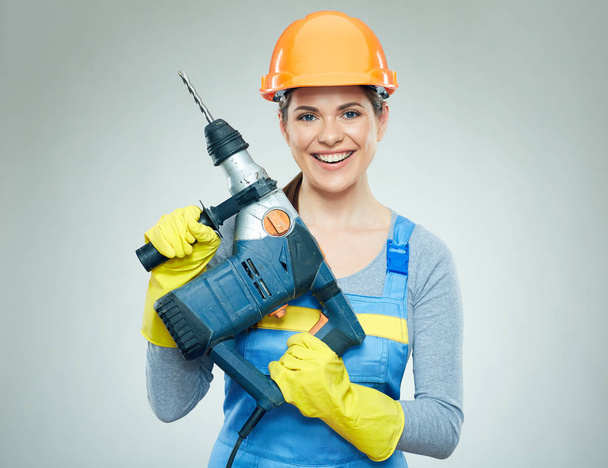 Woman builder holding drill tool.  - Foto, immagini