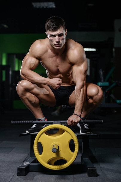 Muscular handsome athletic bodybuilder fitness model posing afte - Фото, зображення
