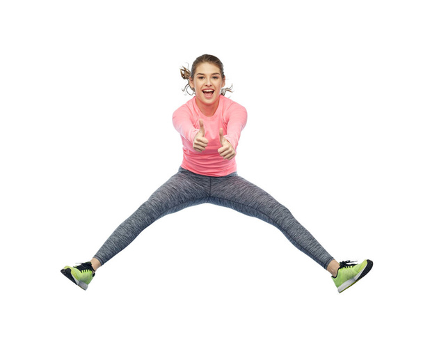 feliz sorrindo esportivo jovem mulher pulando no ar - Foto, Imagem