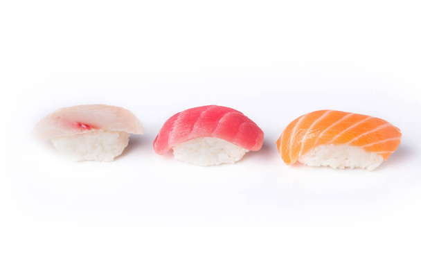 Three sushi in a row isolated at white background - Фото, изображение