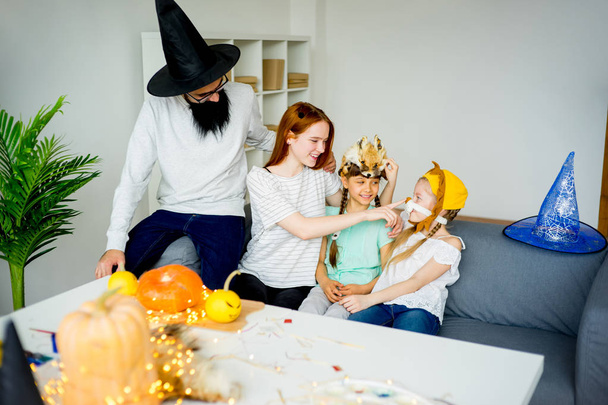 Family dressed in halloween costumes - Foto, afbeelding