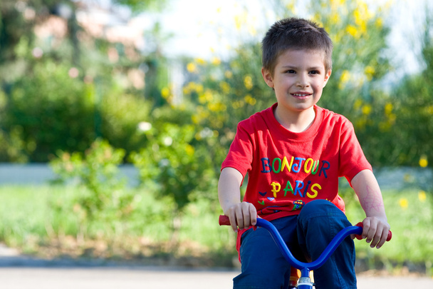 Six year old kid outdoor on bike - Zdjęcie, obraz