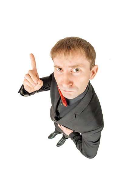 Full length of young business man standing over white background, viewed from above. - Foto, Bild