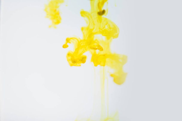 Yellow ink in water, artistic shot, abstract background - Zdjęcie, obraz