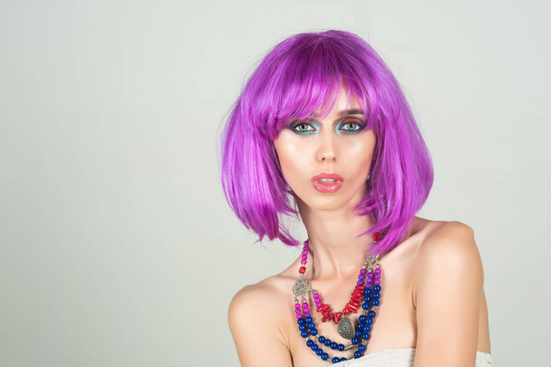 Girl with bright artificial hair in ethnic jewelry. - Foto, Imagem