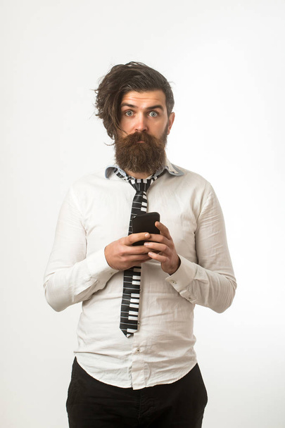 man with surprised face hold mobile phone - Foto, Imagen