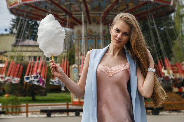  woman eating cotton candy  - Photo, Image