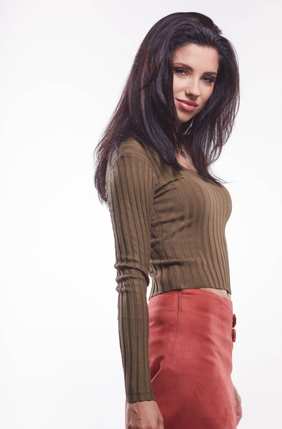 cute woman in green pullover and red skirt  - Foto, imagen