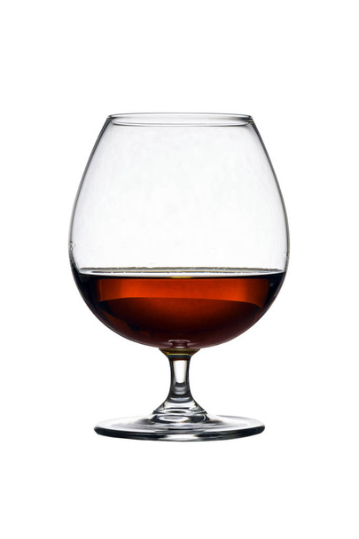 Glass with cognac on white background isolated. Front view. Close up shot. High resolution - Photo, image