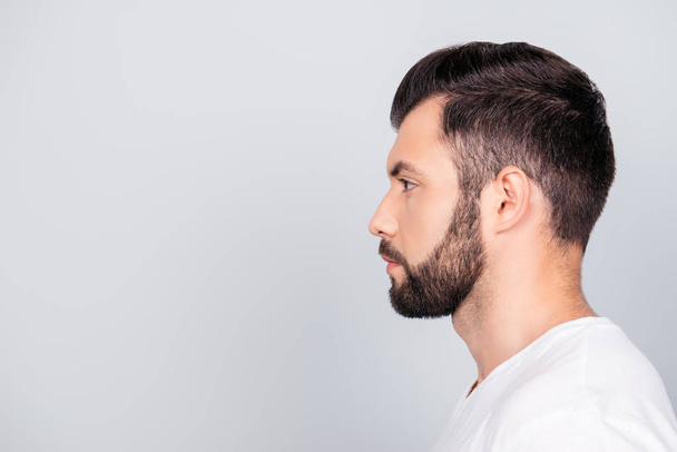 Side profile portrait of a brunet guy, isolated on pure light bl - Photo, Image