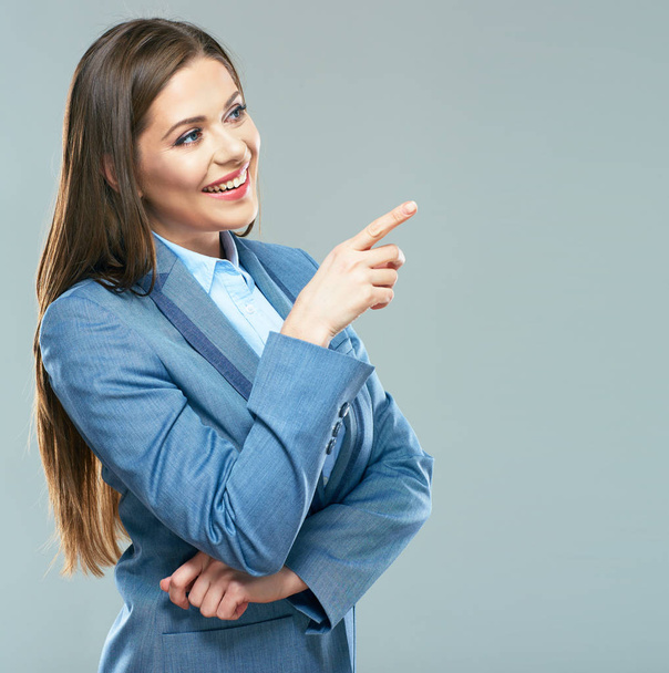 Smiling business woman  pointing finger on copy space. - Photo, Image