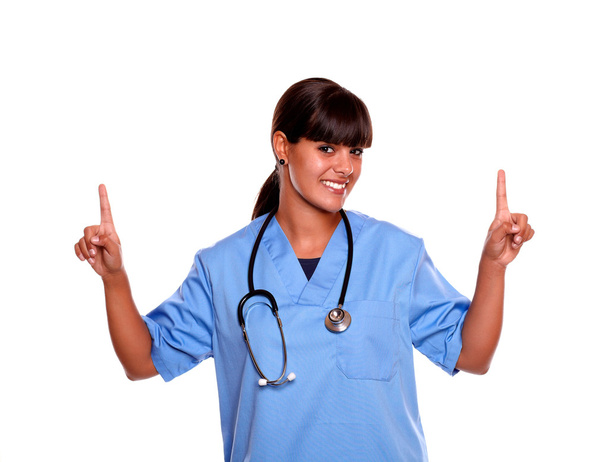 Smiling medical doctor female pointing up - Foto, Imagen