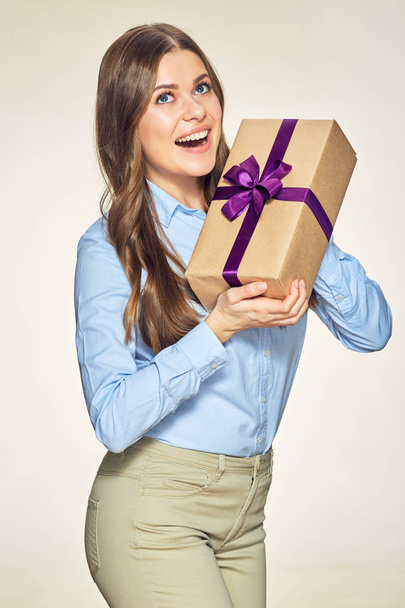 happy woman holding paper gift box.  - Zdjęcie, obraz