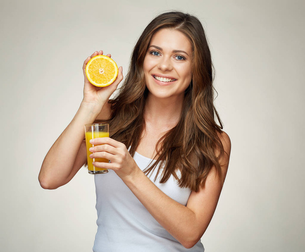 tothy smiling girl portrait with orange juice and fruit.  - Foto, Bild
