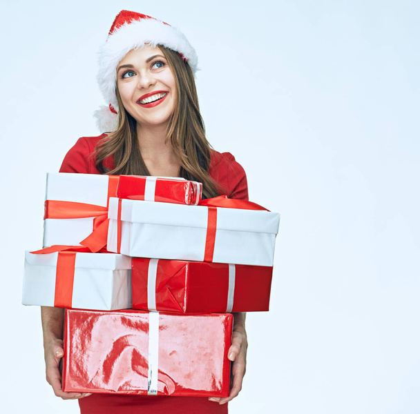 Smiling santa girl in Christmas style holding gift box.  - Foto, imagen