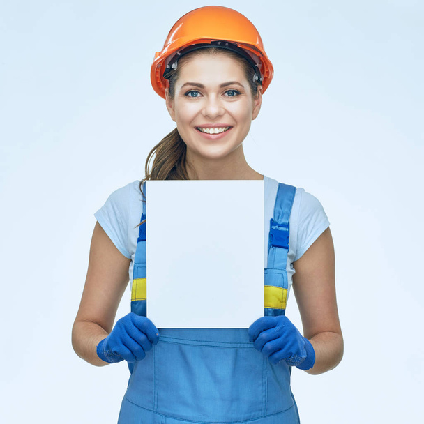 Builder holding white banner with copy space.  - Photo, Image