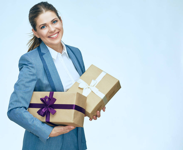 Young business woman standing with gift box against white backgr - Zdjęcie, obraz