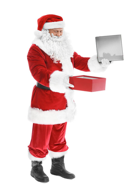 Happy authentic Santa Claus holding gift box on white background - Φωτογραφία, εικόνα