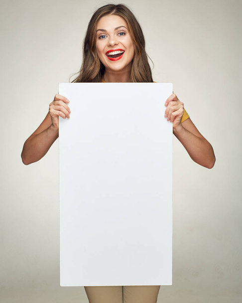 Smiling young woman show white big board for advertising sign.  - Zdjęcie, obraz