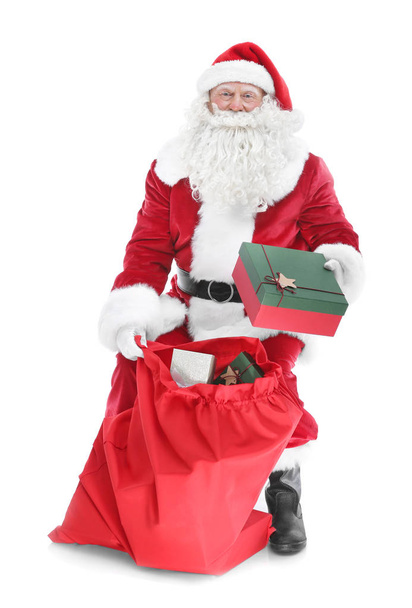 Authentic Santa Claus with big gift bag on white background - Fotoğraf, Görsel
