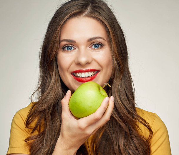 close up face portrait of smiling woman with green apple.  - Foto, imagen