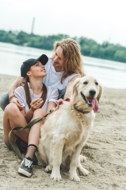 young couple with dog - Foto, Bild