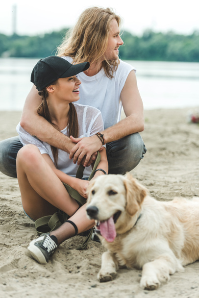 young couple with dog - Foto, Imagen