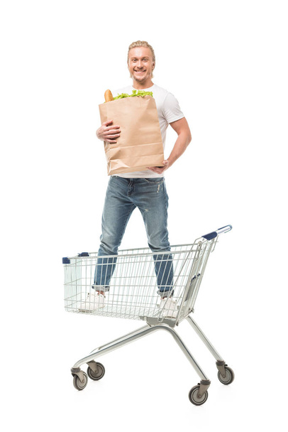 man with paper shopping bag - Фото, изображение
