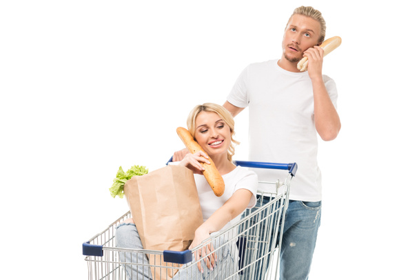 couple with shopping cart - Φωτογραφία, εικόνα
