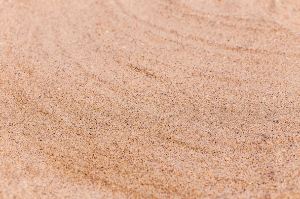 Пісок на пляжі як фон з простором для тексту. Морські подорожі та відпустка. Вибірковий фокус
 - Фото, зображення