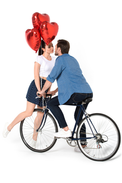 couple with bicycle and balloons - 写真・画像