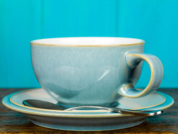 Kínai csésze és csészealj Wirth egy teát kanállal - Fotó, kép
