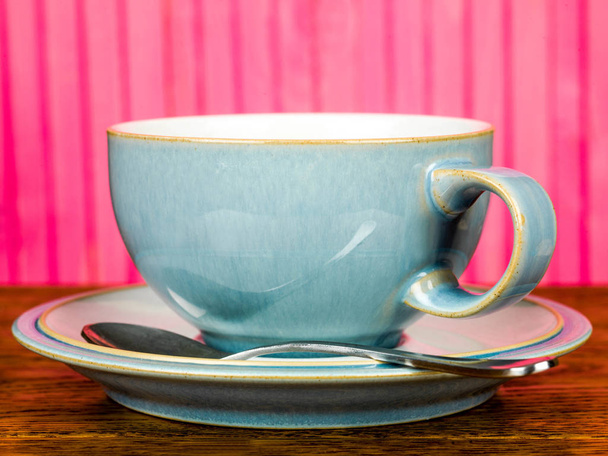 Kínai csésze és csészealj Wirth egy teát kanállal - Fotó, kép
