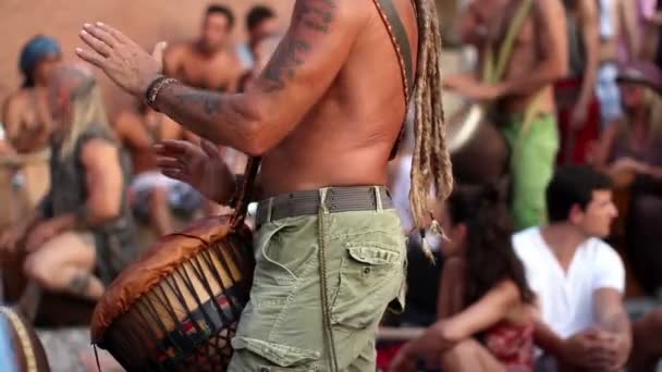 Drummers play on benirras beach in ibiza as sunset starts. - Footage, Video