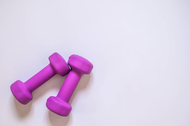 Purple dumbbells, fitness concept isolated on white background,  - 写真・画像