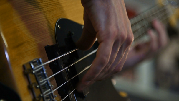 Man Playing On Bass Guitar. Slow Motion Effect - Video, Çekim