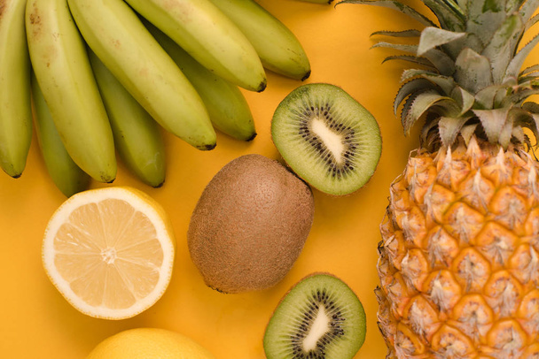 Set of fruits on a yellow background - Фото, зображення