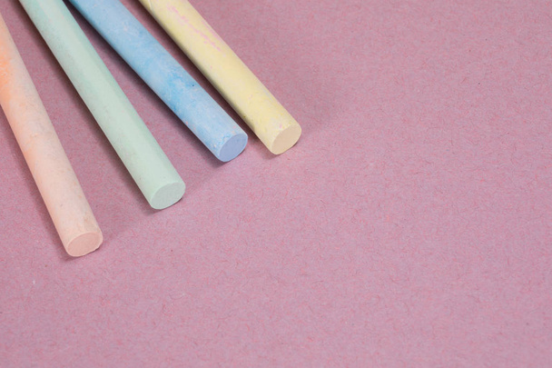 Drawing chalk sticks close up with pink copy space - Photo, Image