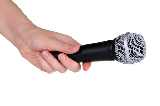 Black microphone in hand isolated on white - Fotoğraf, Görsel