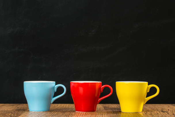 three colors of coffee cups with blue red yellow - Valokuva, kuva