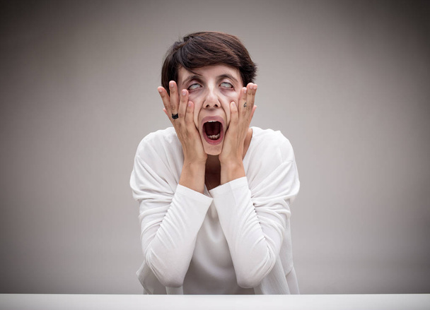 woman making the scream icon face - Photo, Image