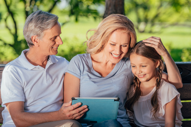 family with digital tablet - Фото, изображение