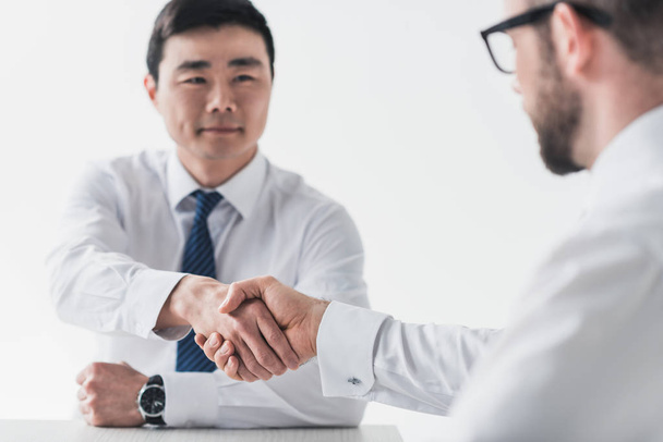 multicultural businessmen shaking hands on meeting - Photo, Image