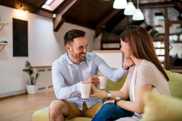 Couple relaxing at home with coffee  - Foto, Imagem